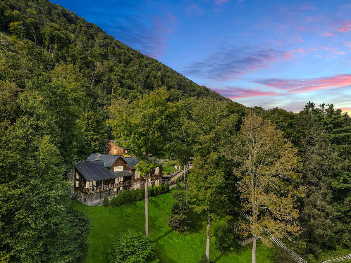 The houses are surrounded by mountains.