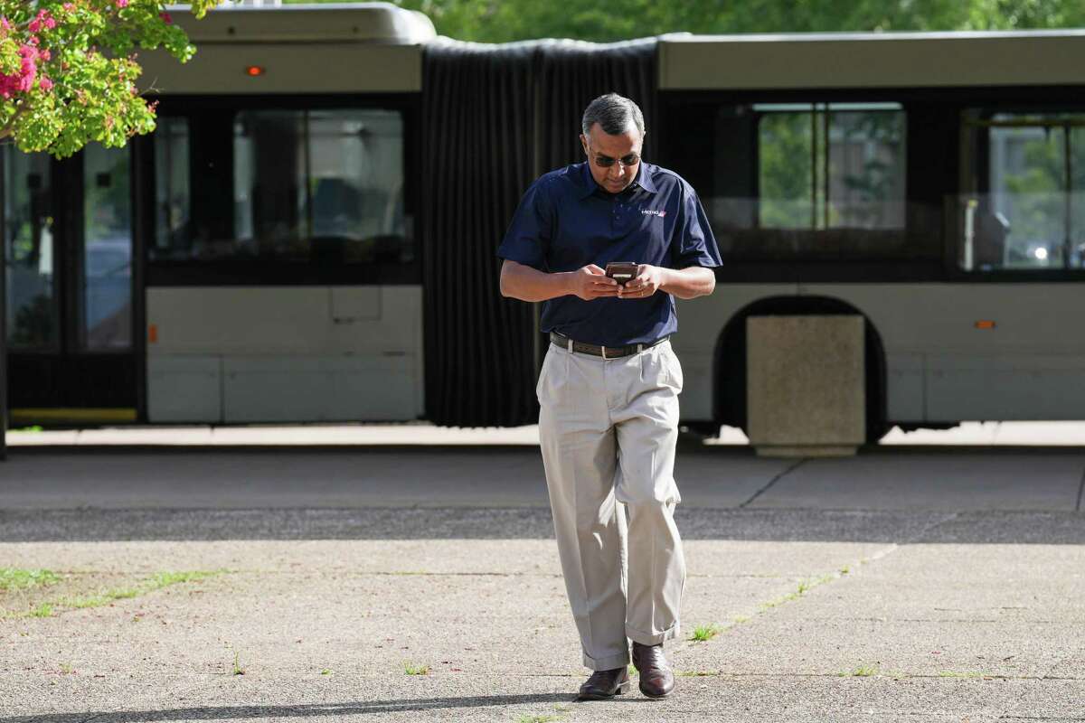 Metropolitan Transit Authority chairman Sanjay Ramabhadran walks through Metro’s Eastwood Transit Center on his way to discuss the planned University Line bus rapid transit project Friday, July 8, 2022 in Houston.
