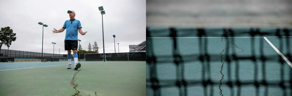 Jeff Petersen shows a cracked tennis court at the Harbor Bay Club in Alameda.