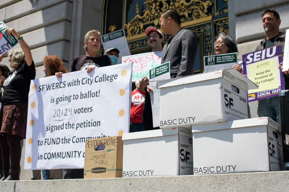 City College of San Francisco dance instructor Kathe Burick and other college supporters rally outside City Hall before delivering boxes of ballot signatures for a parcel tax measure to benefit the school, on Monday, July 11, 2022.