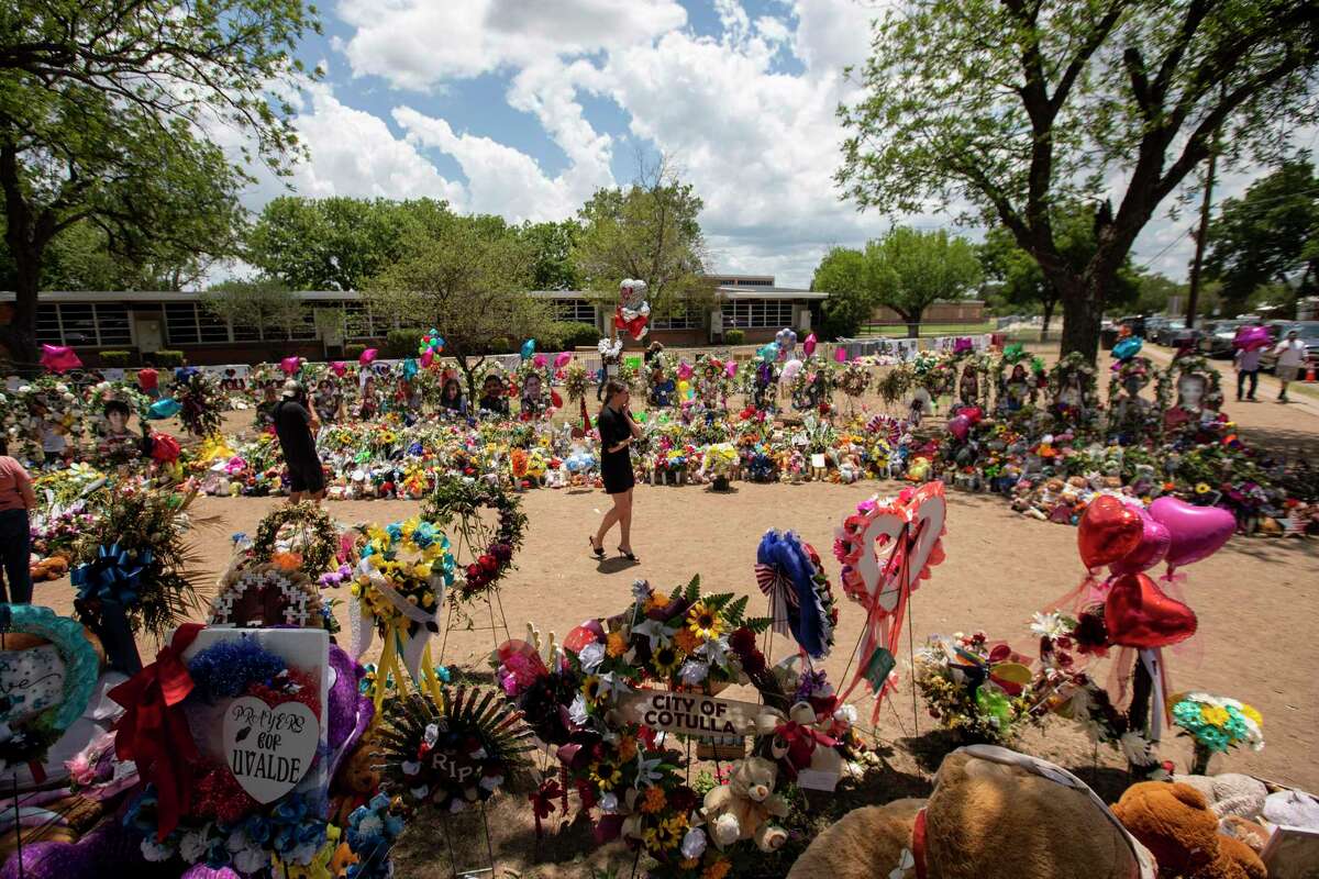 Part of a large makeshift memorial to the victims of a mass shooting at Robb Elementary School, where 19 students and two teachers were killed, in Uvalde, Texas on June 3, 2022. Heavily armed officers delayed confronting the gunman for more than an hour despite supervisors at the scene being told that some trapped with him in two classrooms were in need of medical treatment, a new review of video footage and other investigative material shows. (Ivan Pierre Aguirre/The New York Times)