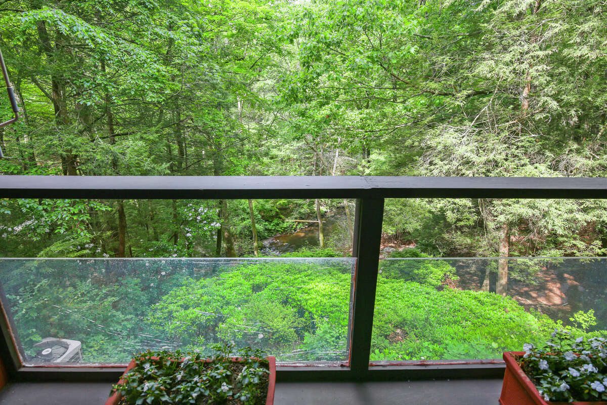 A porch overlooking the more than 4 acres of land at home on 21 Hycliff Road in Greenwich, Conn.