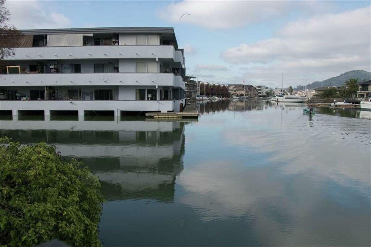 An apartment building in San Rafael is seen during a king tide in December. The Bay Area is experiencing king tides through Thursday night that could bring minor flooding to low-lying areas.