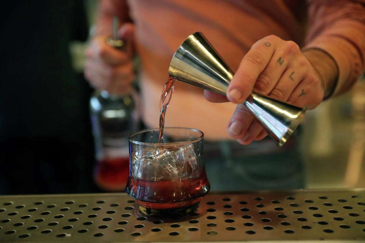 Nicolas Torres makes a Cobbler cocktail at Buddy in San Francisco’s Mission District.