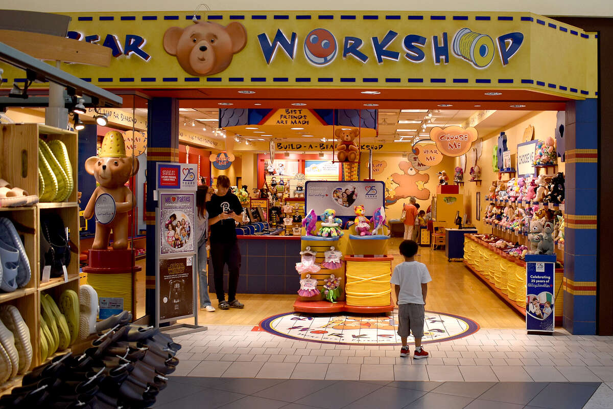 A young patron of the Valley Plaza Mall in Bakersfield stands expectantly at the threshold of the Build-A-Bear Workshop. 