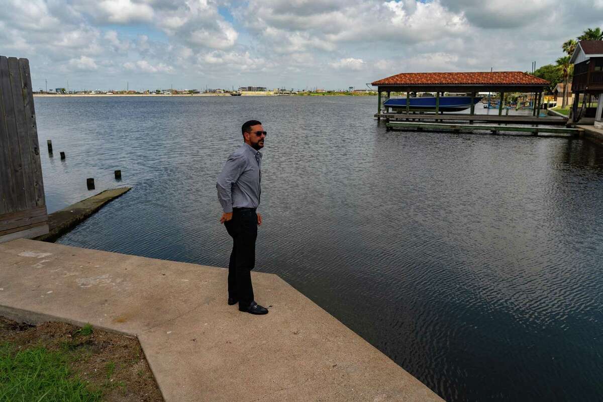 Brandon Cook, who works for the city of Galveston, points out the area where a pump station will be, with the objective of keeping water out of city streets, on May 11, 2022, in Galveston.