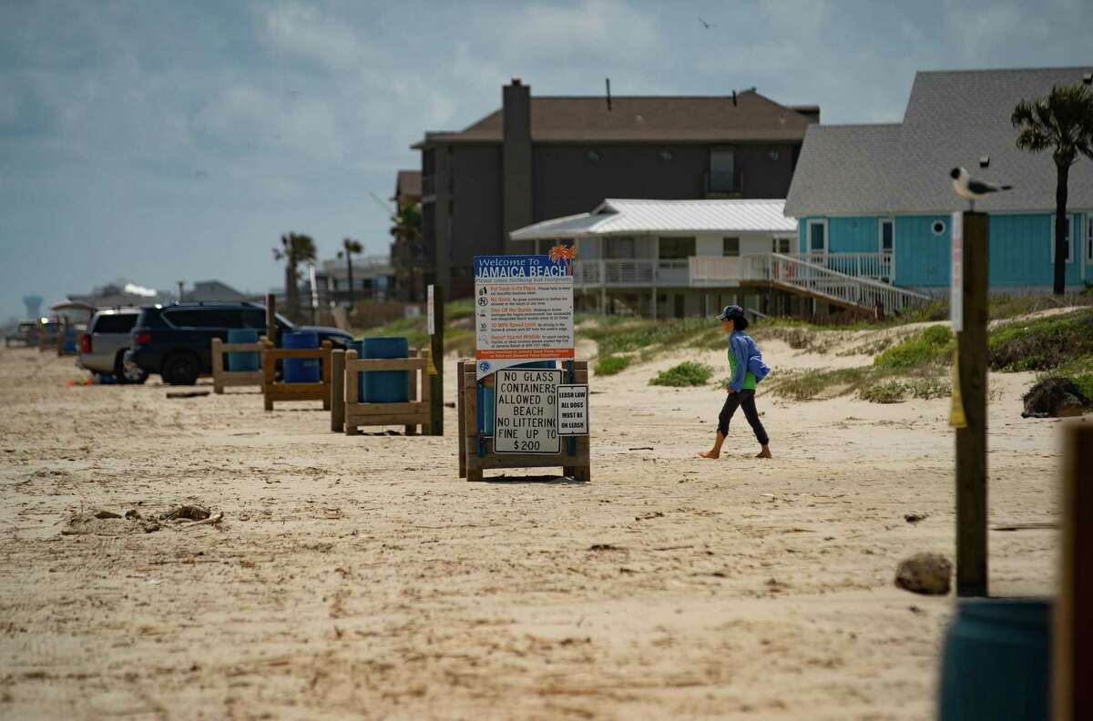 The city keeps cars from driving onto an area where they are trying to rebuild the dunes that help protect the city from the Gulf of Mexico, on May 11, 2022, in Jamaica Beach on Galveston Island.