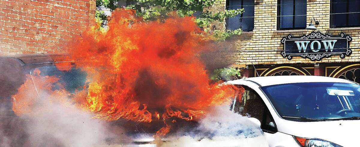 John Badman|The Telegraph WOW seemed to be the common response of people who stopped to watch flames engulf a Ford Edge in Alton Tuesday morning.