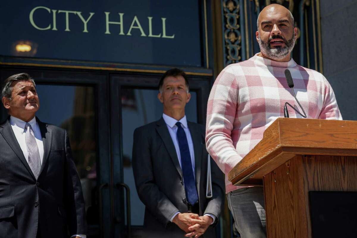 Tyler TerMeer, CEO of the San Francisco AIDS Foundation, speaks during a press conference at City Hall. He says the agency’s monkeypox hotline is ringing off the hook.