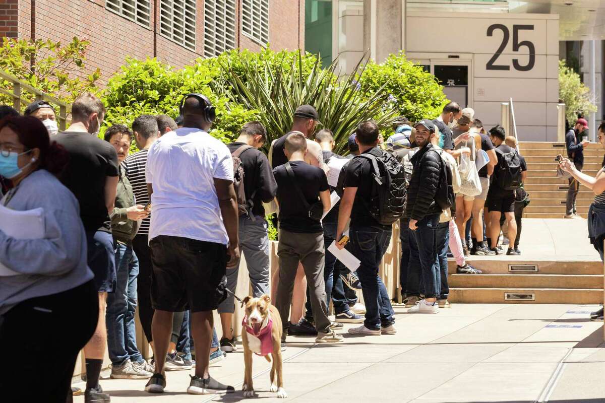 People stand in long lines to receive the monkeypox vaccine at San Francisco General Hospital on July 12.