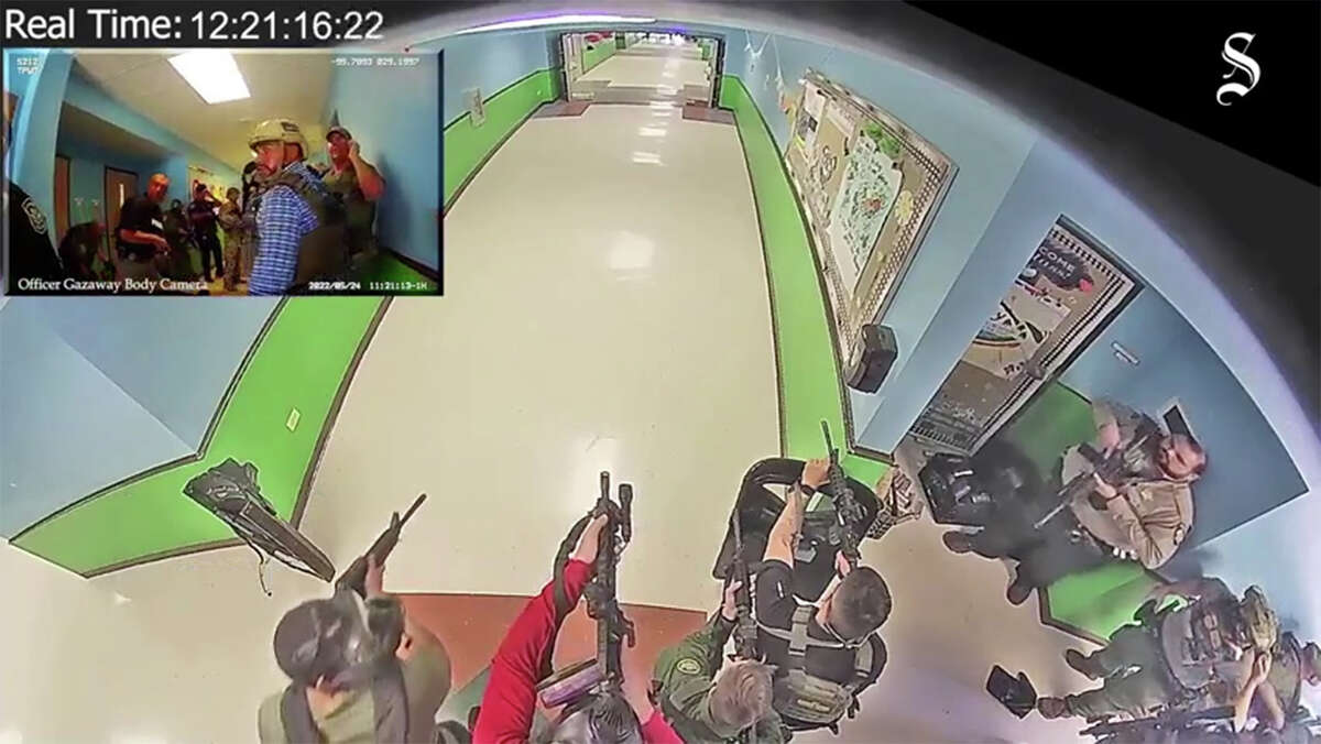 Screenshot from the video, obtained by the Austin American-Statesman and KVUE, shows the confusion inside Robb Elementary School as police stand outside classrooms.