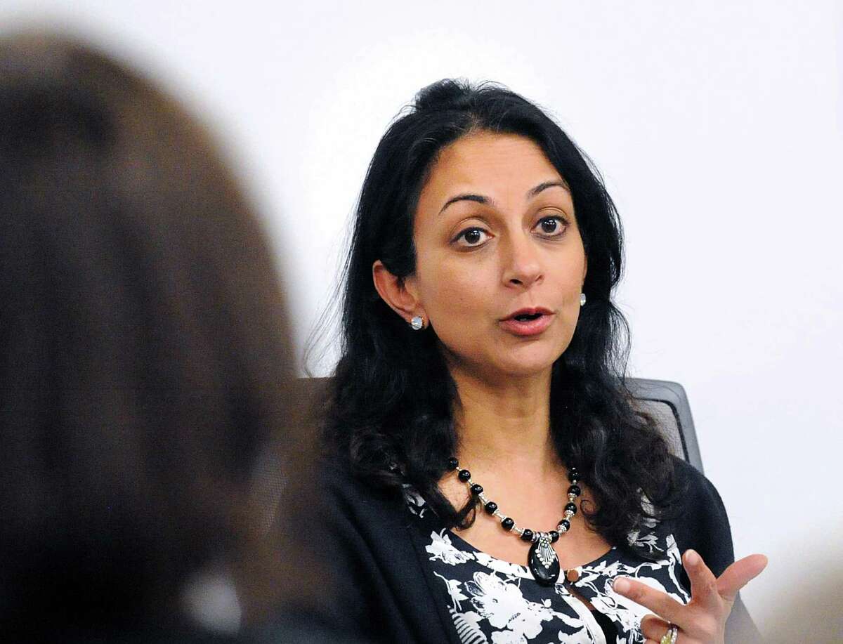 Former Wall Street trader Dita Bhargava of Greenwich, a Democrat considering a run for governor, makes a point about pay equity for women during a panel discussion after the screening of the film "Battle of the Sexes" featuring the life story of tennis great Billie Jean King's 1973 matchup with Bobby Riggs at Fairfield County's Community Foundation in Norwalk, Conn., Thursday night, Feb. 15, 2018.