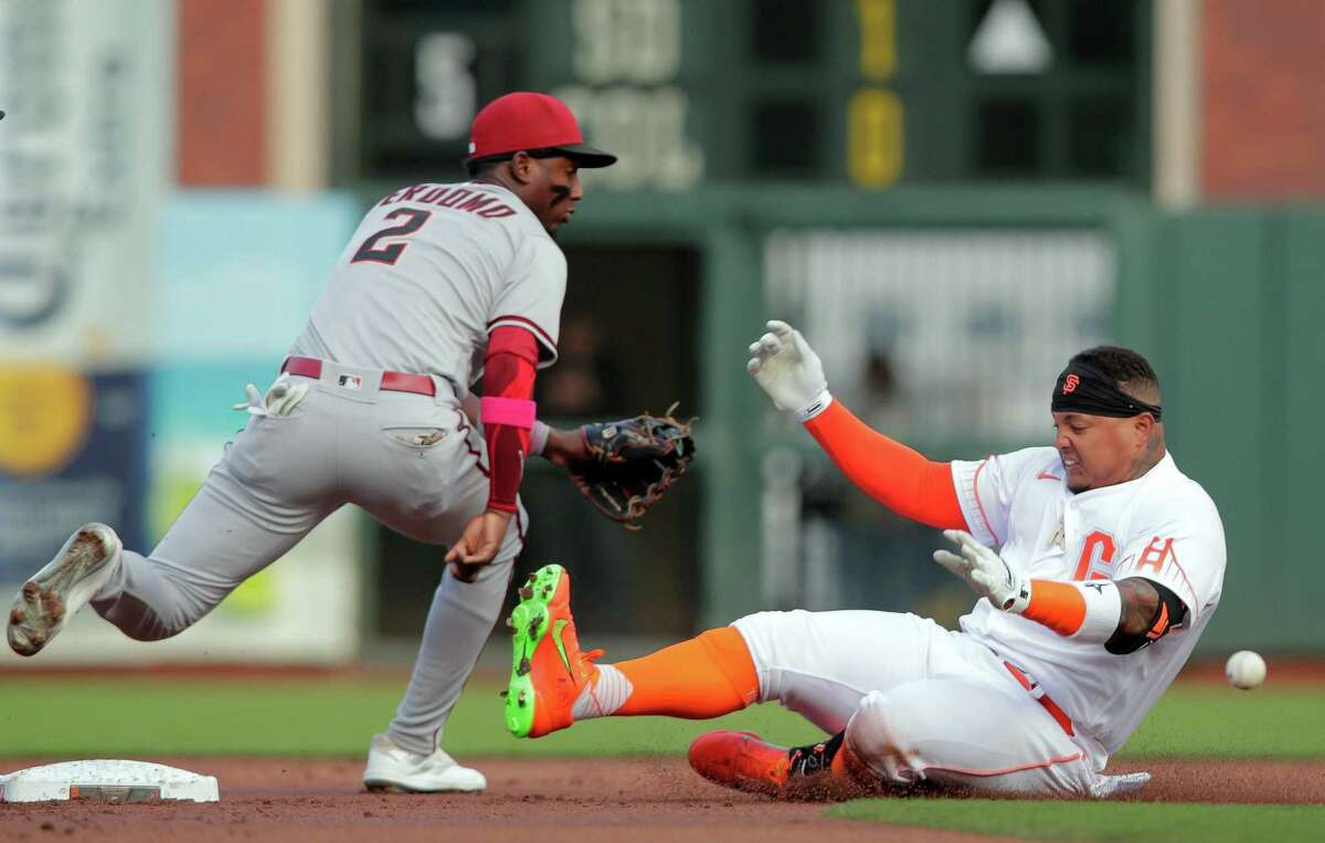 Yermin Mercedes (6) slides in for a double in the second inning as the San Francisco Giants played the Arizona Diamondbacks at Oracle Park in San Francisco, CA, Calif., on Tuesday, July 12, 2022.