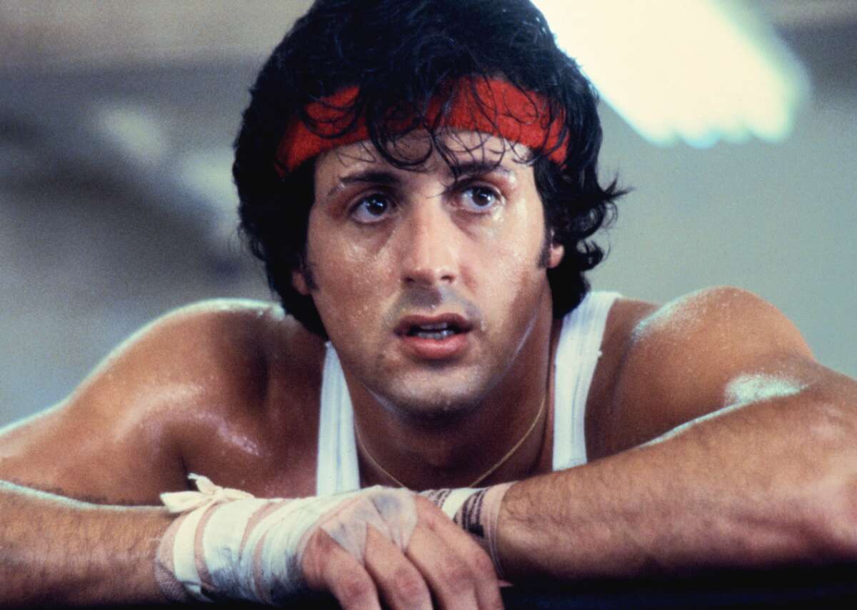 Every ‘Rocky’ movie, ranked Since 1976, the story of Philadelphia underdog boxer Rocky Balboa’s (Sylvester Stallone) unlikely road to the world heavyweight championship has led to a sprawling boxing franchise spanning eight films. The first “Rocky” film got off to a particularly strong start, becoming the highest-grossing film of the year and taking home three Oscars. From there, five Rocky-centric sequels followed and were met with varying degrees of acclaim—looking at you, “Rocky V.” However, the franchise got a shakeup with the advent of the “Creed” films. Michael B. Jordan stars as the son of Rocky’s late rival, Apollo Creed (Carl Weathers), and the new protagonist turns to the original star for mentorship in the ring. The films have effectively revitalized the “Rocky” series, but how do all eight films compare to each other? To find out, Stacker ranked every “Rocky” movie according to a Stacker score, which is weighted evenly between IMDb user rating (which measures popular reception) and Metascore (which measures critical reception). Any ties were broken by IMDb votes. So sit back, queue up “Gonna Fly Now” or “Eye of the Tiger,” and check out which entries in this beloved boxing franchise should jump to the top of your watchlist. You may also like: Can you guess which iconic movie these scenes are from?