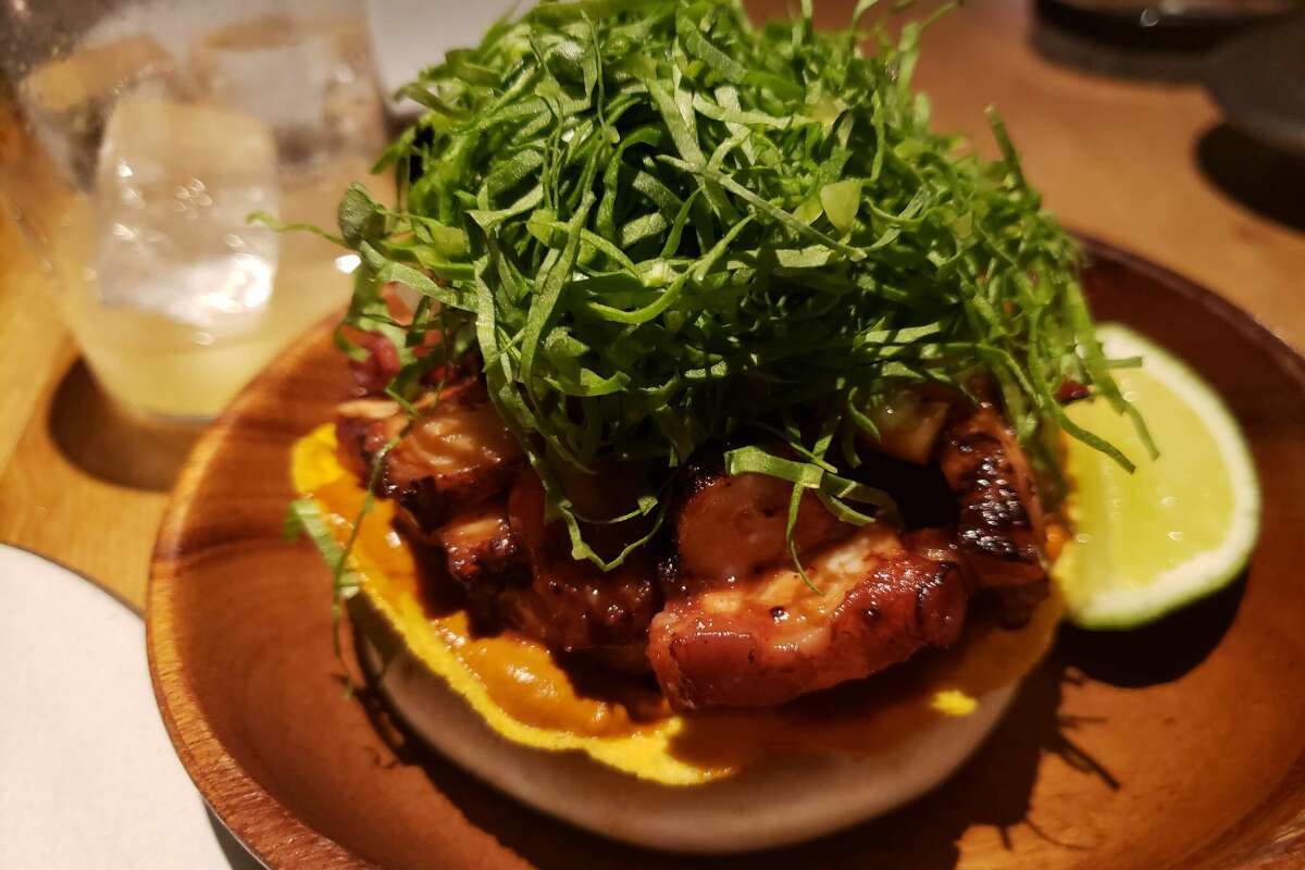 Juicy sliced ​​octopus, seasoned with basil pepper, was sitting under a straw of shaved sorrel at Cosme's in New York.
