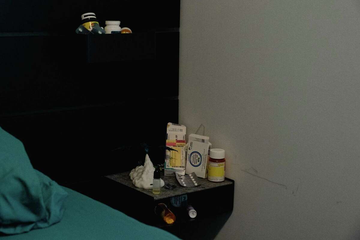 Pamela McCarroll's medications sit by her bed in the home. She's had an increase in spam calls since her cancer diagnosis, and many appear to be health-related.