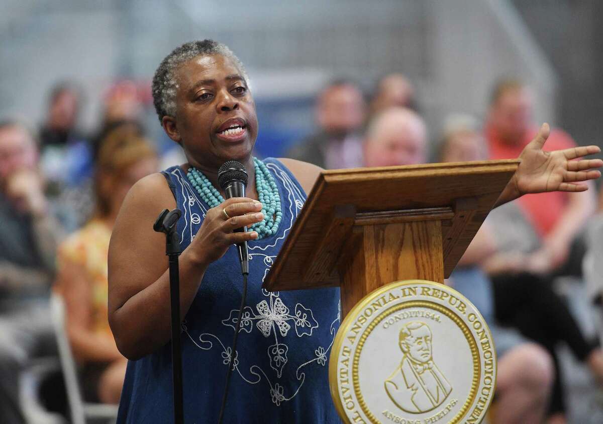 Ansonia resident Lydia Douglas expresses her hopes for the development of Olson Drive for affordable housing during a public meeting to discuss the impending sale of the property at the Ansonia Armory in Ansonia, Conn. on Tuesday, July 12, 2022.