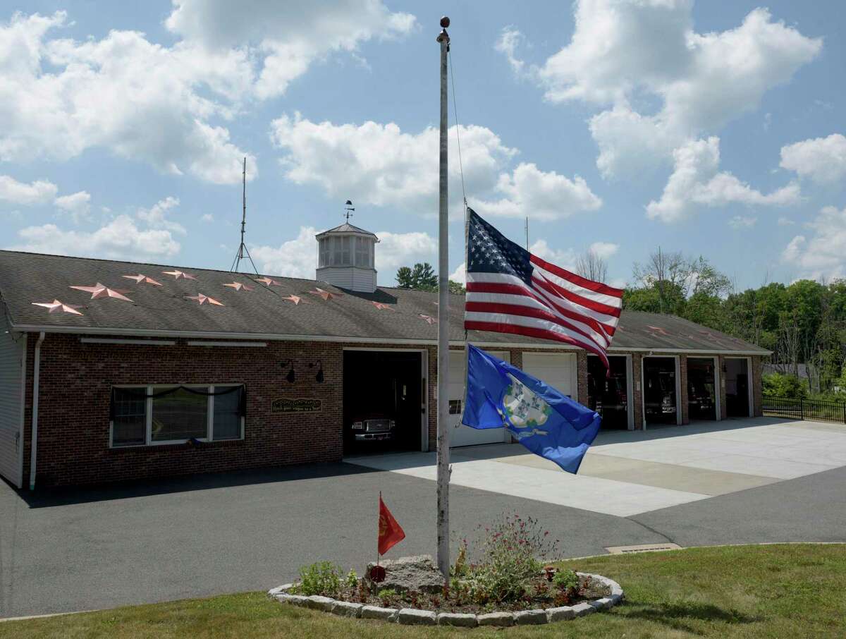 Sandy Hook Volunteer Fire & Rescue Co. flags at half-mast after the death of longtime chief, William Halstead. on Monday in Newtown.
