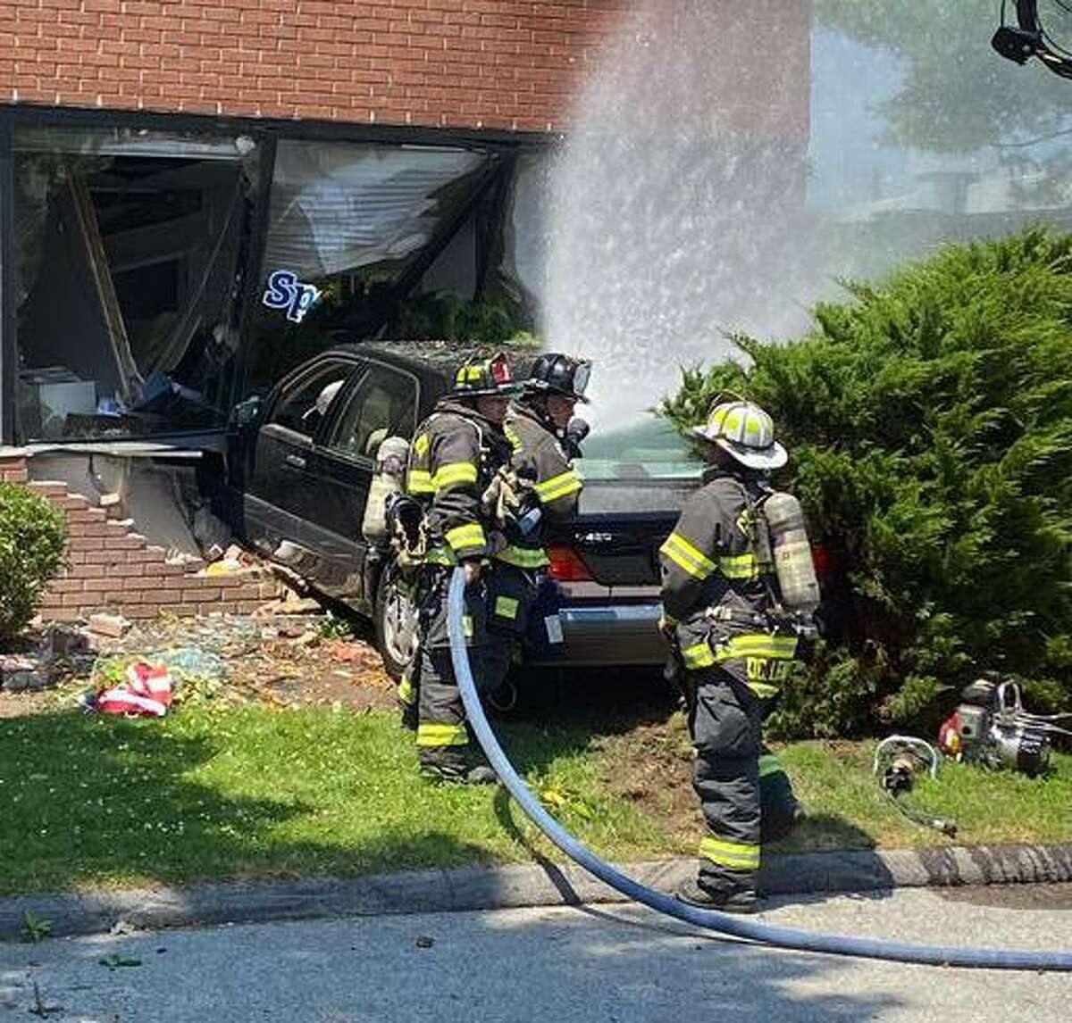 Greenwich firefighters extricated the driver of a vehicle that slammed into a building on Railroad Avenue Tuesday.