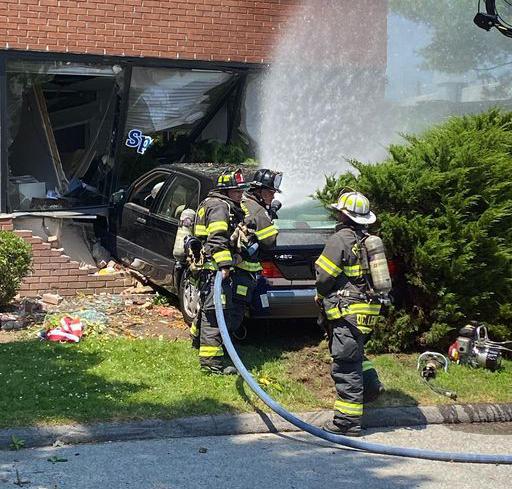 Greenwich car crash into building sends three to emergency room