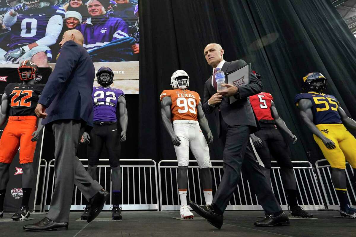 New Big 12 commissioner Brett Yormark, right, follows outgoing boss Bob Bowlsby into a new realm, the topsy-turvy world of college athletics.