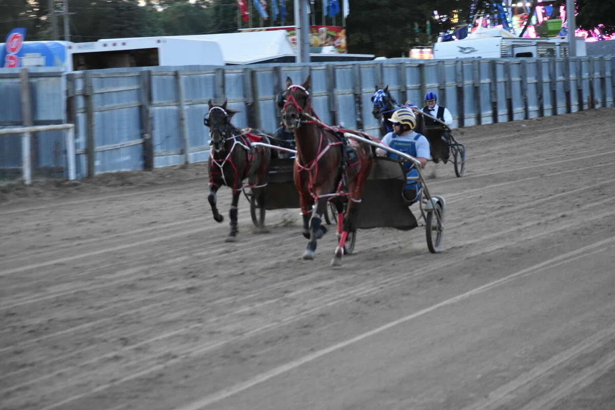 Dennis Behler looks back as he comes to the finish line to win the Celebrity Race.