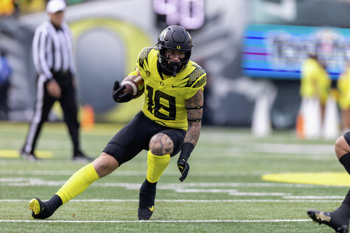  Spencer Webb (18) of the Oregon Ducks runs with the ball against the Colorado Buffaloes at Autzen Stadium on October 30, 2021 in Eugene, Oregon. 