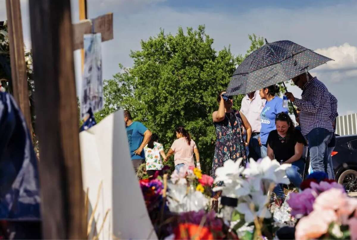 Gloria Quezada on July 1, 2022, visiting the memorial site where her daughter Adela Betulia Ramírez Quezada, 27, died the previous month in an abandoned tractor-trailer in San Antonio. Credit: Chris Stokes for The Texas Tribune