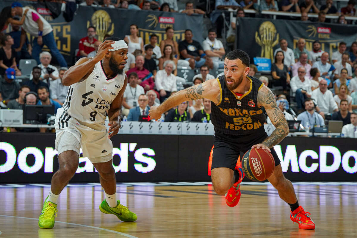 Mike James drives past a defender during a EuroLeague game. James has re-signed with AS Monaco. 