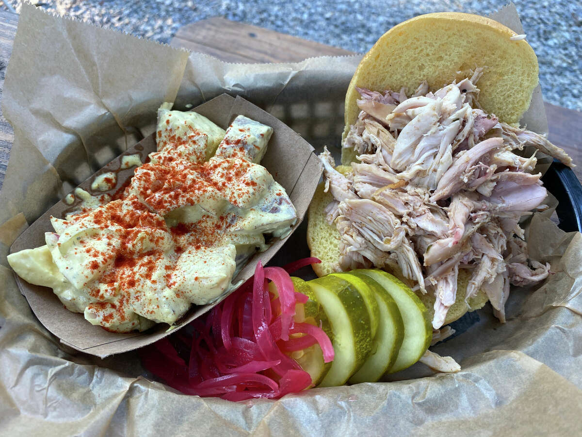 Smoked, pulled chicken in a sandwich can be dosed, or doused, in four available sauces reflective of different states' barbecue styles at The Gem in Bolton Landing.