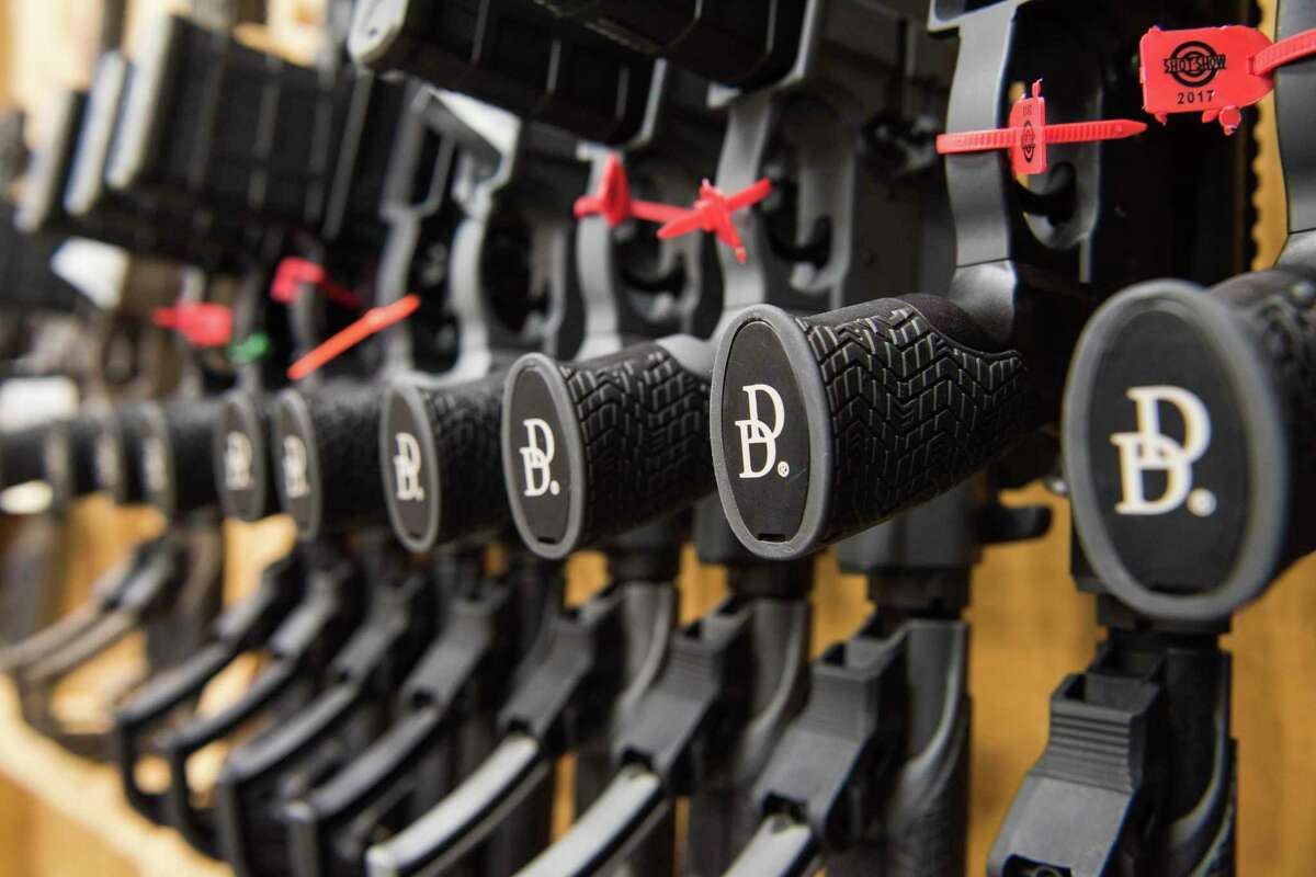 In this March 9, 2017, photo a row of AR-15 style rifles manufactured by Daniel Defense sit in a vault at the company's headquarters in Black Creek, Ga. The company, based in Black Creek, Georgia, and founded in 2001, is one of the industry leaders in the making of long guns in the United States. (AP Photo/Lisa Marie Pane)