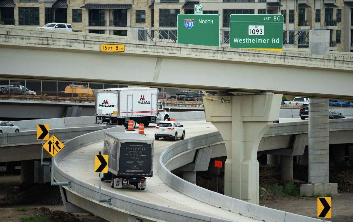 Vehicles turn into the northbound lanes of northbound Loop 610 from Interstate 69, on July 14, 2022, in Houston. Work continues on the interchange, with construction not expected to be completed until 2024.