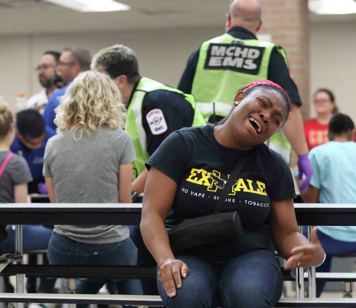 A Caney Creek High School student cries as she takes part in a mock exercise, Wednesday, July 13, 2022, in Granderland. The drill gave Conroe ISD and multiple local and county agencies the opportunity to respond to a scenario where several students ingested a substance with a drug later reveled as fentanyl and needed immediate medical attention.