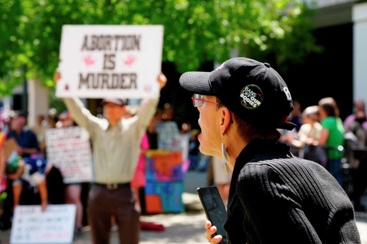 A woman supporting abortion rights shouts at antiabortion protesters outside the South Carolina Capitol on July 7 in Columbia, S.C.