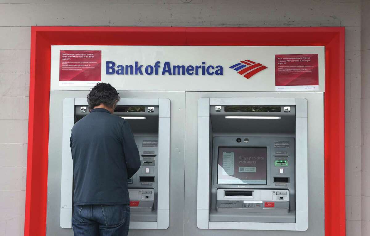 A Bank of America customer uses an ATM at a branch office in San Francisco.