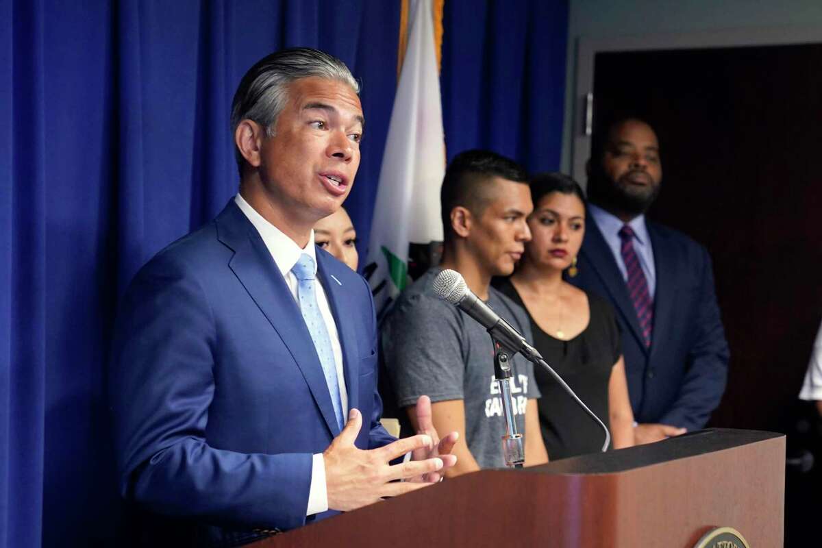 California Attorney General Rob Bonta, left, was dealing with a massive data breach the same day he discussed a 33% rise in hate crimes in California last year at a news conference in Sacramento, Calif., Tuesday, June 28, 2022.