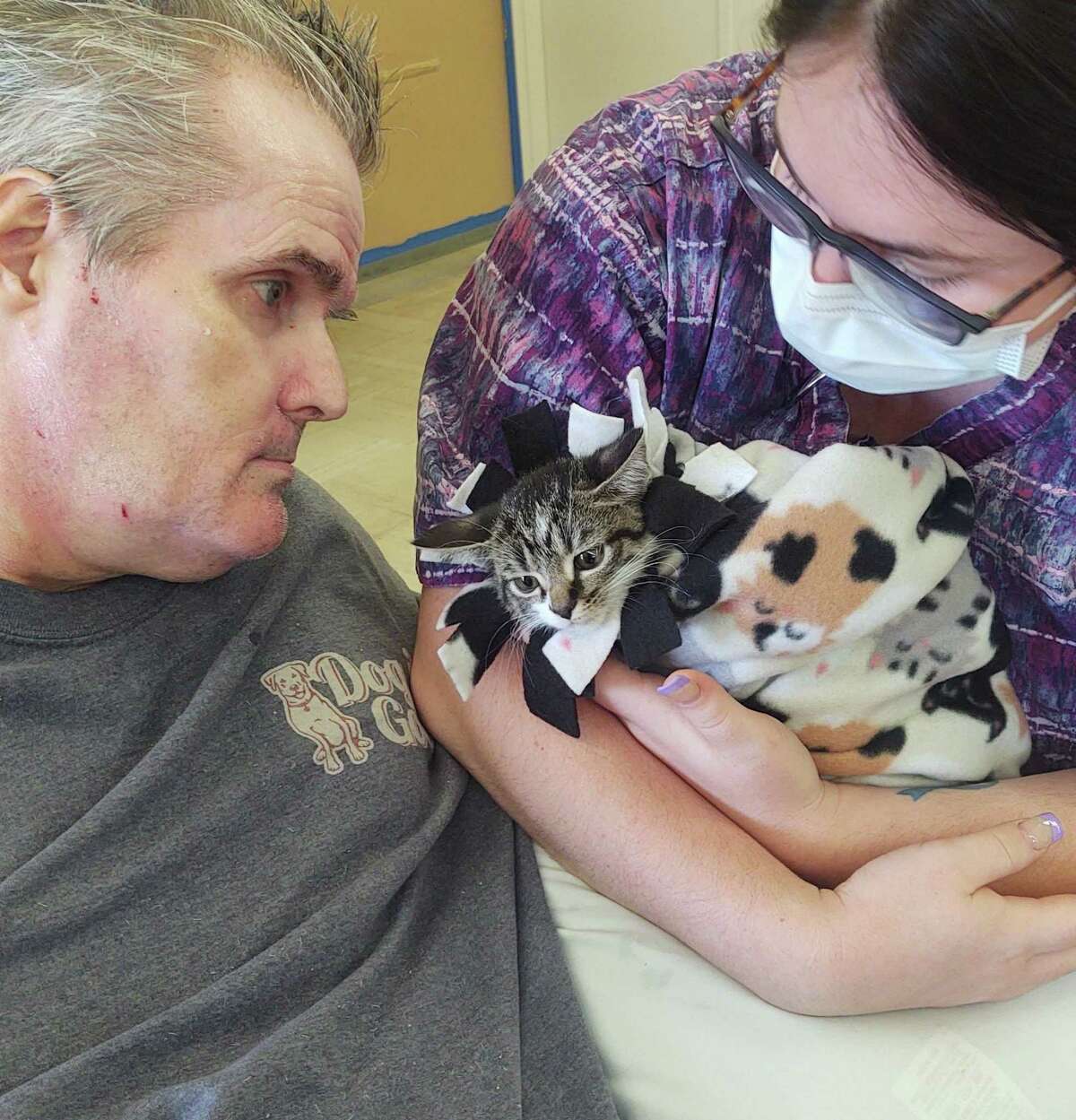 Eight rescue kittens from Westchester-based Rock ‘n Rescue visited residents at New Milford’s Village Crest Center for Health and Rehabilitation. At Village Crest Certified Nursing Assistant Catherine Peek presents Mike Dion with a cuddly kitten.