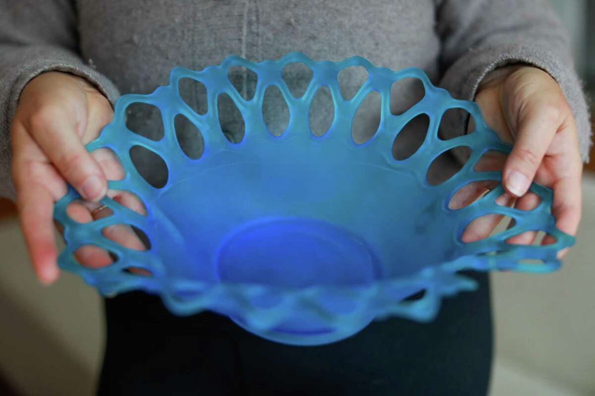 Sarah Maple shows off her grandmother’s bowl that was saved from her old home in Boulder Creek.  The house survived the 2020 CZU Lightning Complex fire, but was uninhabitable due to smoke damage.