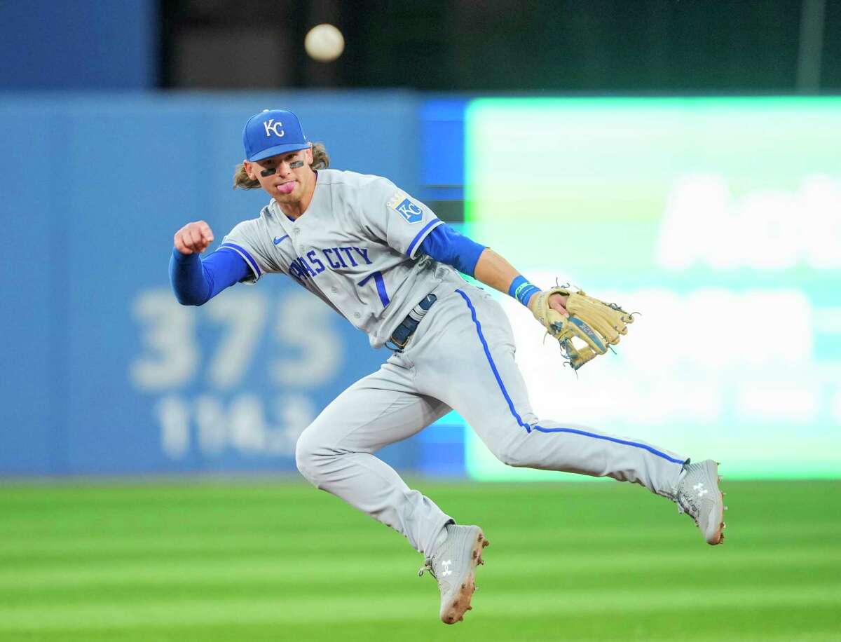 Royals infielder Bobby Witt Jr. fires the ball to first base but couldn’t turn the double play in the fifth inning in Toronto.