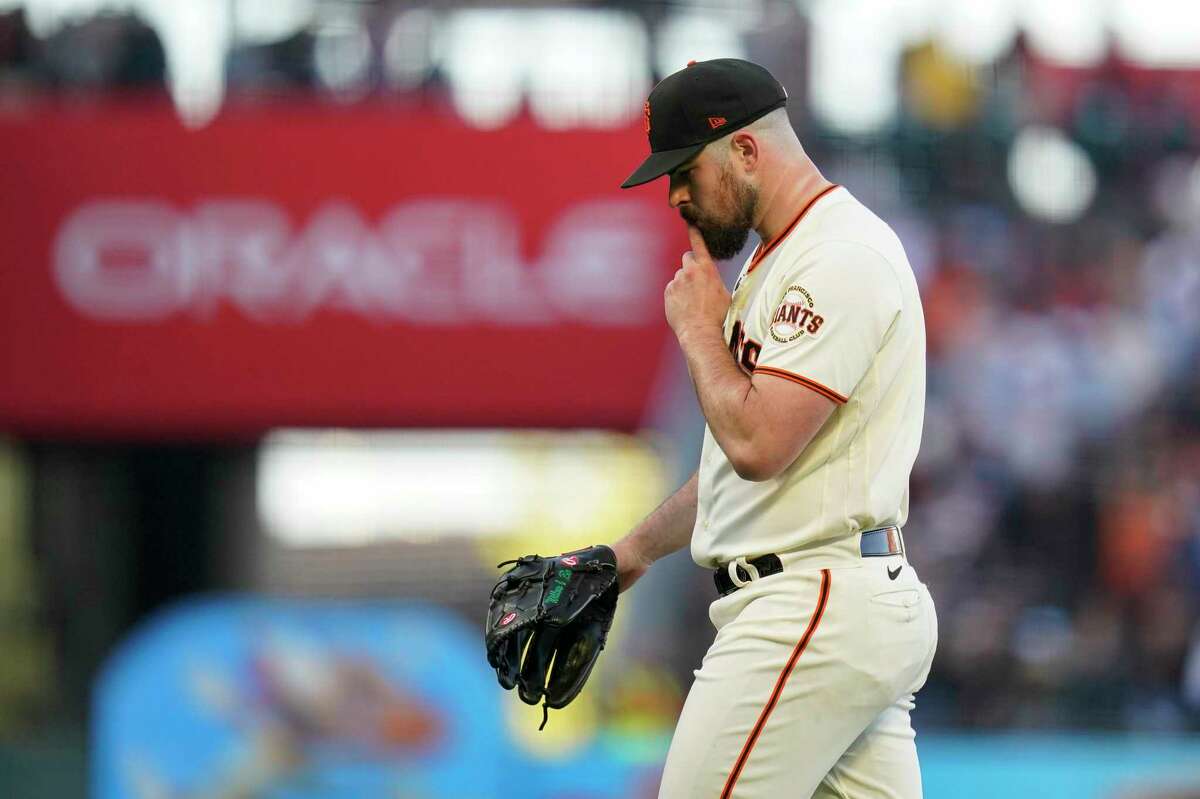 San Francisco Giants' Carlos Rodón reacts after a strikeout with the bases loaded against the Milwaukee Brewers during the second inning of a baseball game in San Francisco, Thursday, July 14, 2022. (AP Photo/Godofredo A. Vásquez)