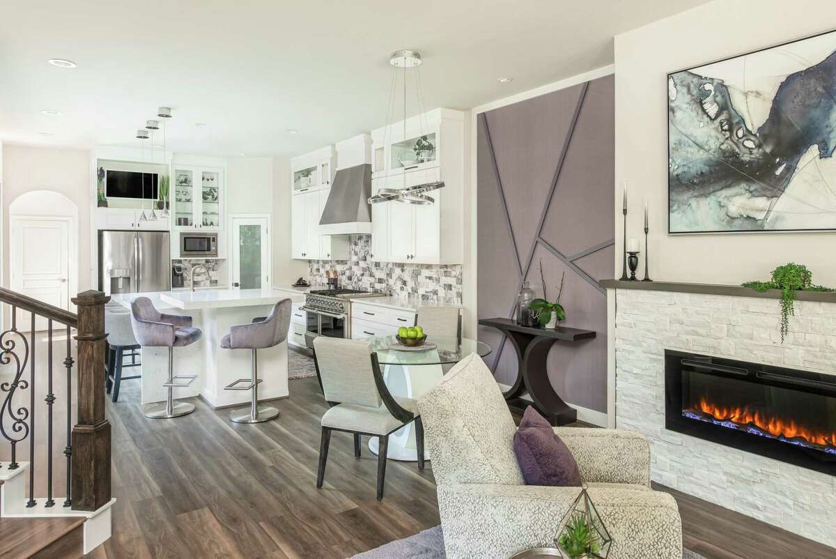 After: In the dining area, wallpaper and fretwork combine on an accent wall.