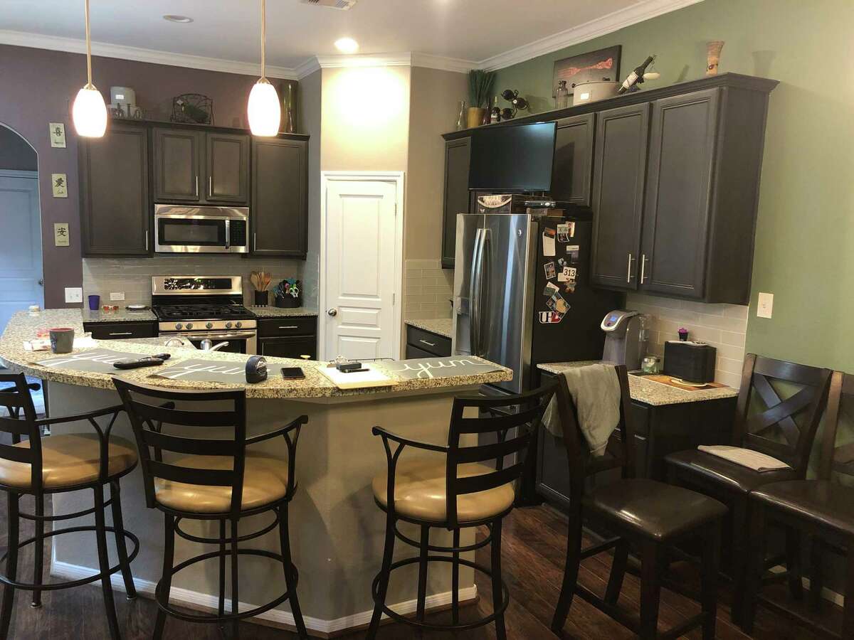 Before: The kitchen was smaller, with less storage space and a C-shaped island that wasn't very functional.