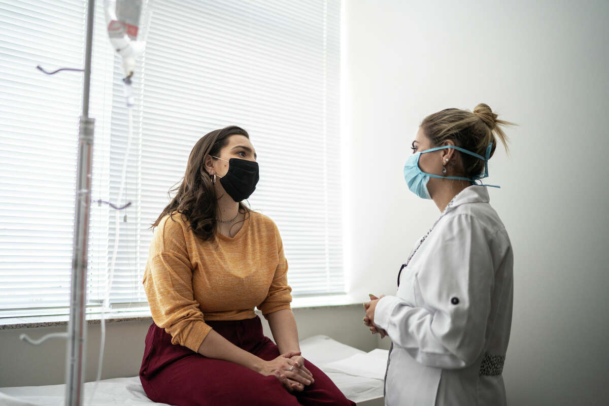 STOCK IMAGE Patient talking to doctor on medical appointment.