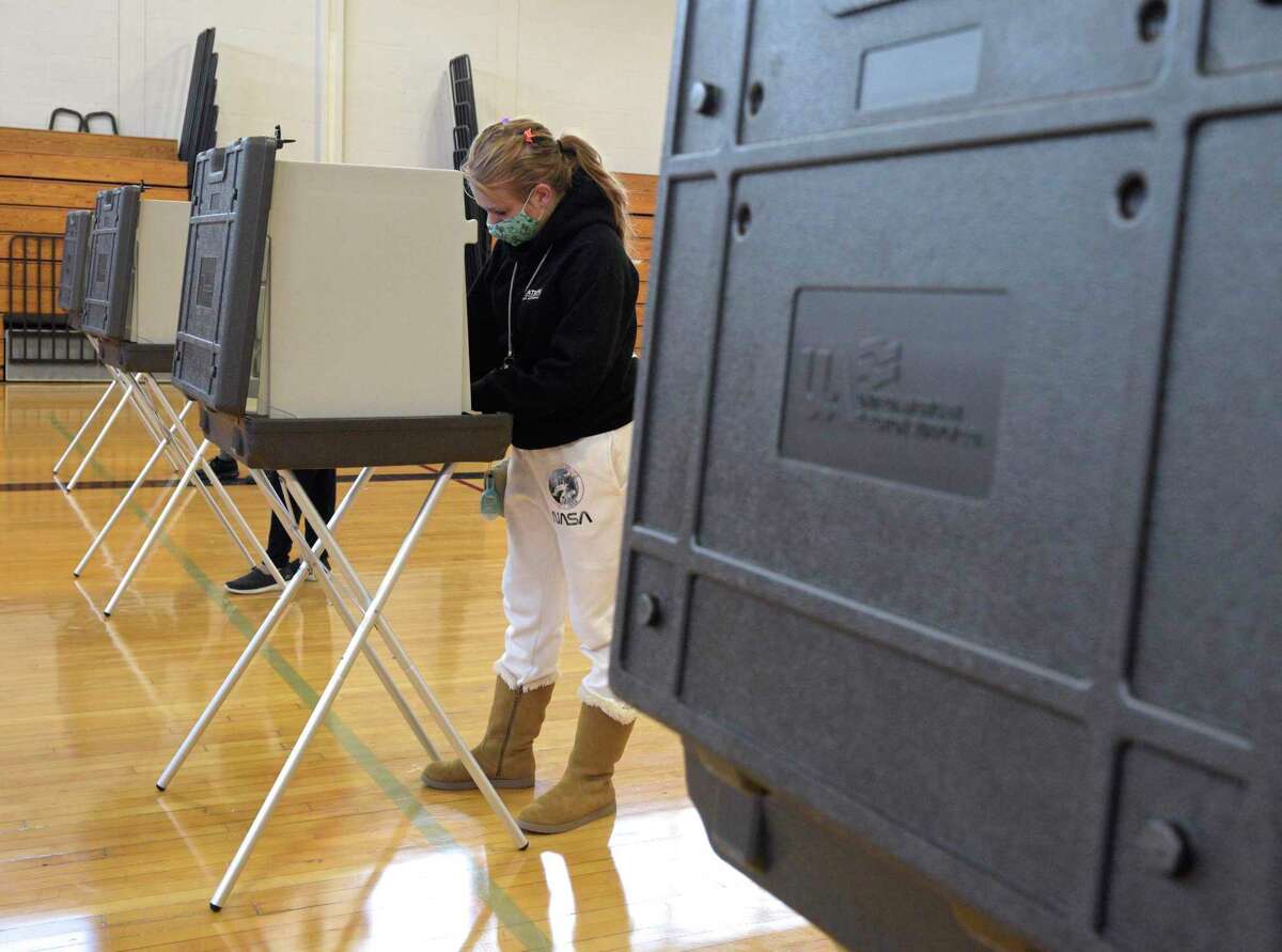 Katie Czyr, of Bethel, waits to vote at the Municipal Center gym polling location, Election Day, Tuesday. November 3, 2020, in Bethel, Conn.