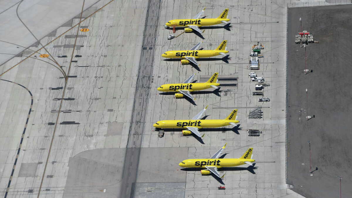 An aerial view shows Spirit Airlines jets parked at Harry Reid International Airport on May 21, 2020, in Las Vegas.