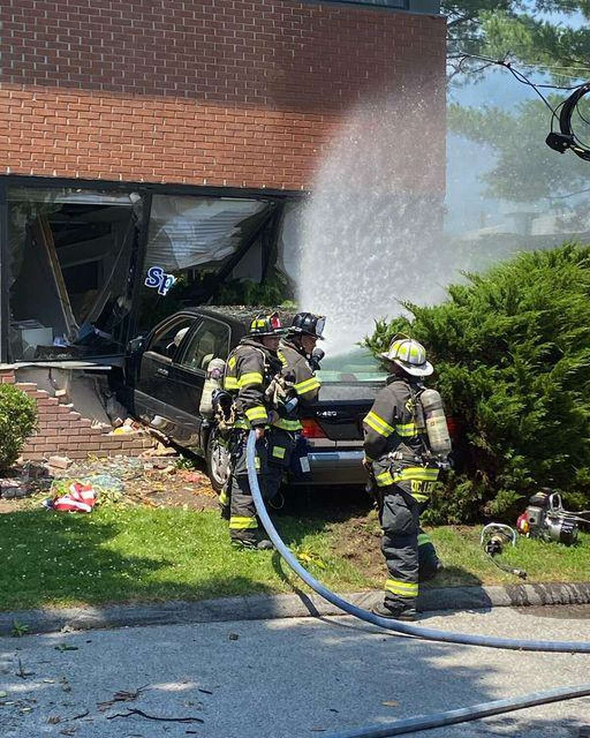 An office building on Railroad Avenue suffered extensive damage when a car rammed into it Tuesday.
