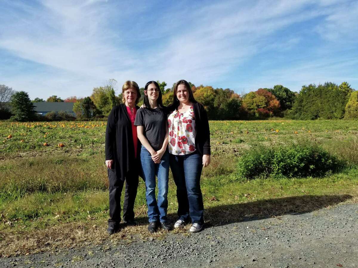 Sherry Kuiper, right, is part of a small group attempting to get her anscestor, Alse Young exonerated. Young was tried and executed for Witchcraft in 1647, in Windsor. Here, Kuiper is shown with her mother, Cris Gansell-Whitcomb, left, and daughter, Belle Albert, center.