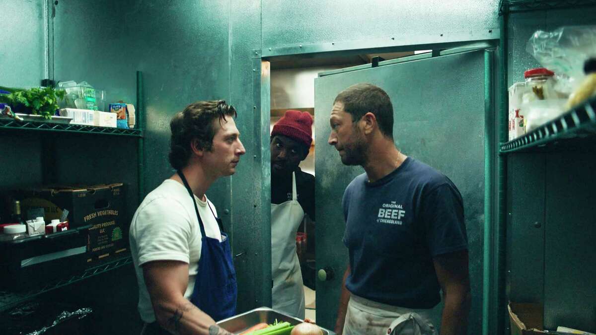 This image released by FX shows Jeremy Allen White, left, and and Ebon Moss-Bachrach, right, in a scene from "The Bear." White stars as Carmen "Carmy" Berzatto, a five-star chef running a Chicago dive sandwich shop that he inherited from his older brother. (FX via AP)