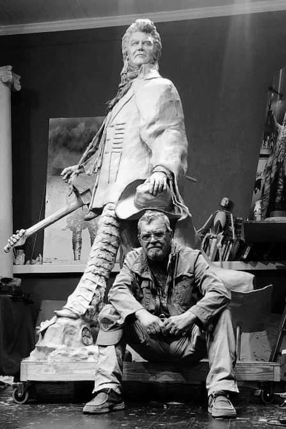 As Conroe sculptor Craig Campobella moves on from his downtown gallery, he is celebrating the unveiling of his Marty Stuart statue in Mississippi in May. He is pictured here with his Marty Stuart statue “The Pilgrim.” He worked on the statue in his downtown Conroe gallery.