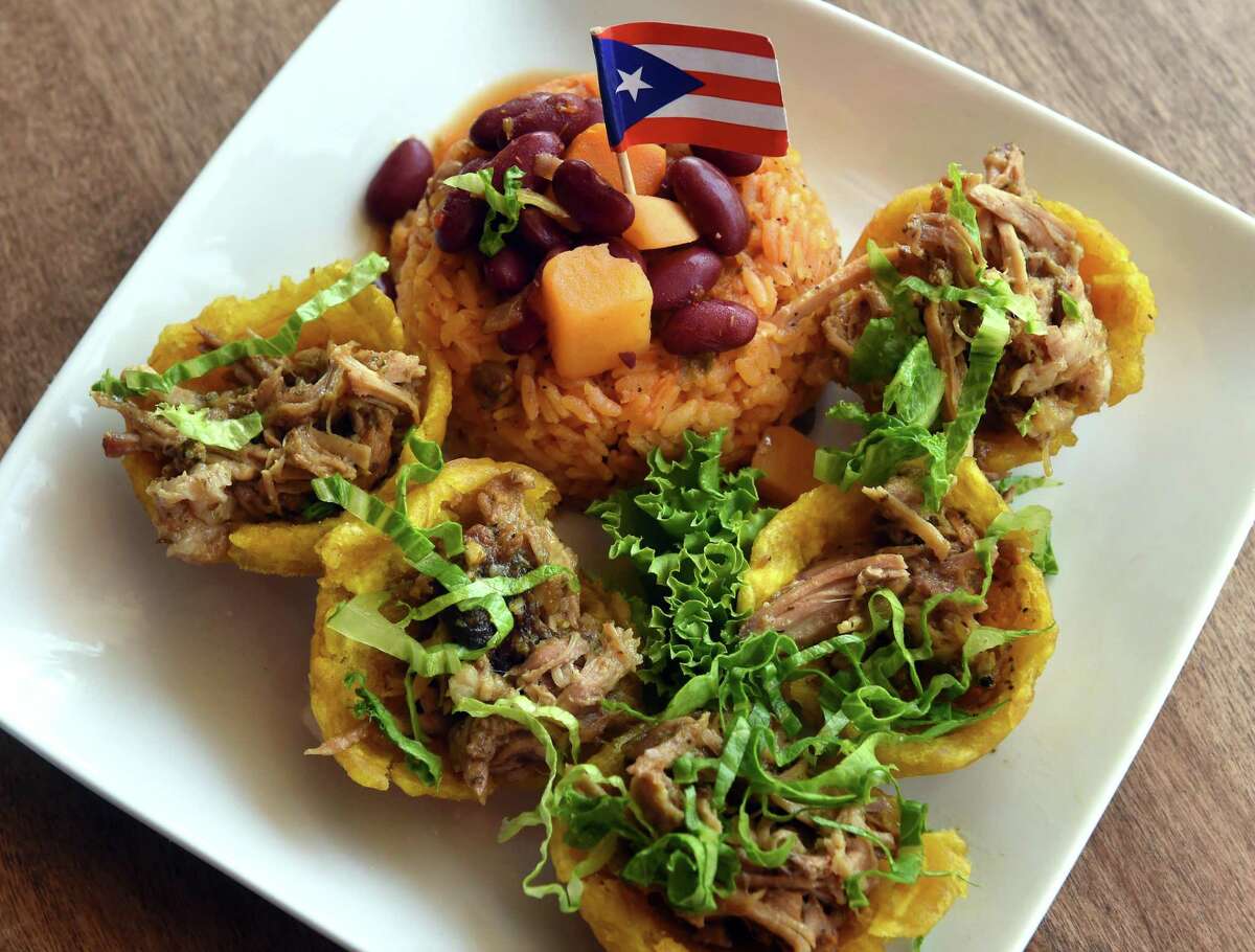 Tostones rellenos consisting of fried platanos cups filled with roasted pork with yellow beans and rice prepared by Vinoda Singh at La Isla on Dixwell Avenue in Hamden.